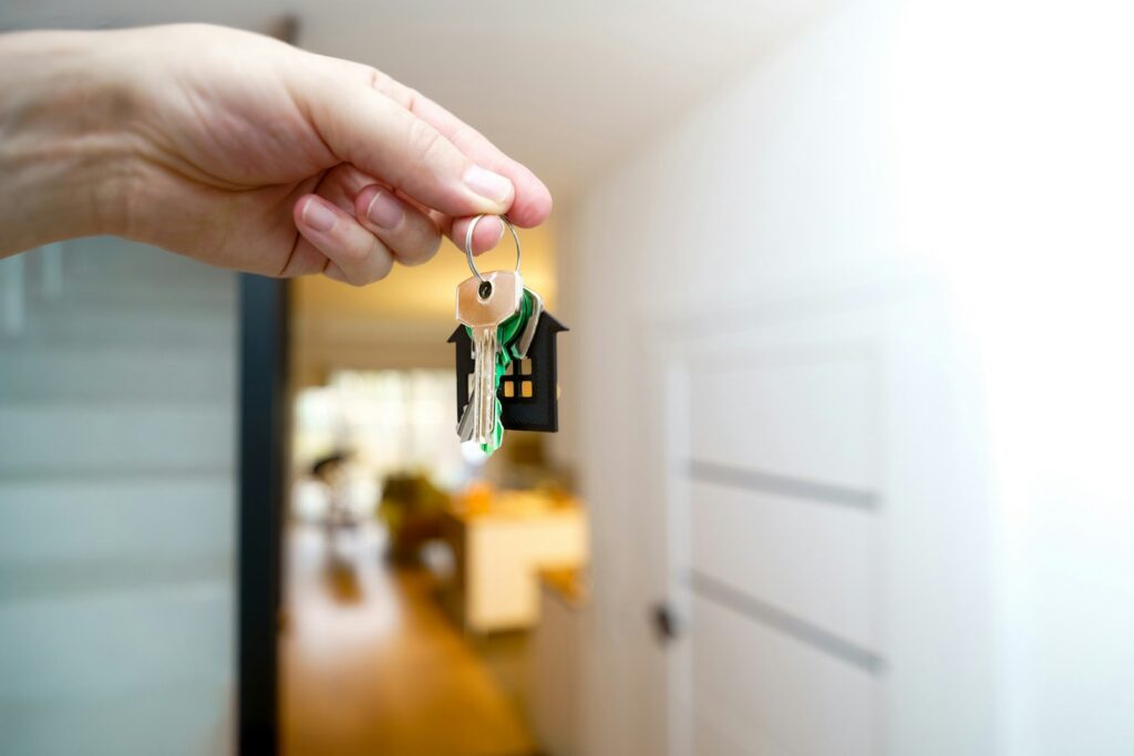 Hand holding the keys to a new home