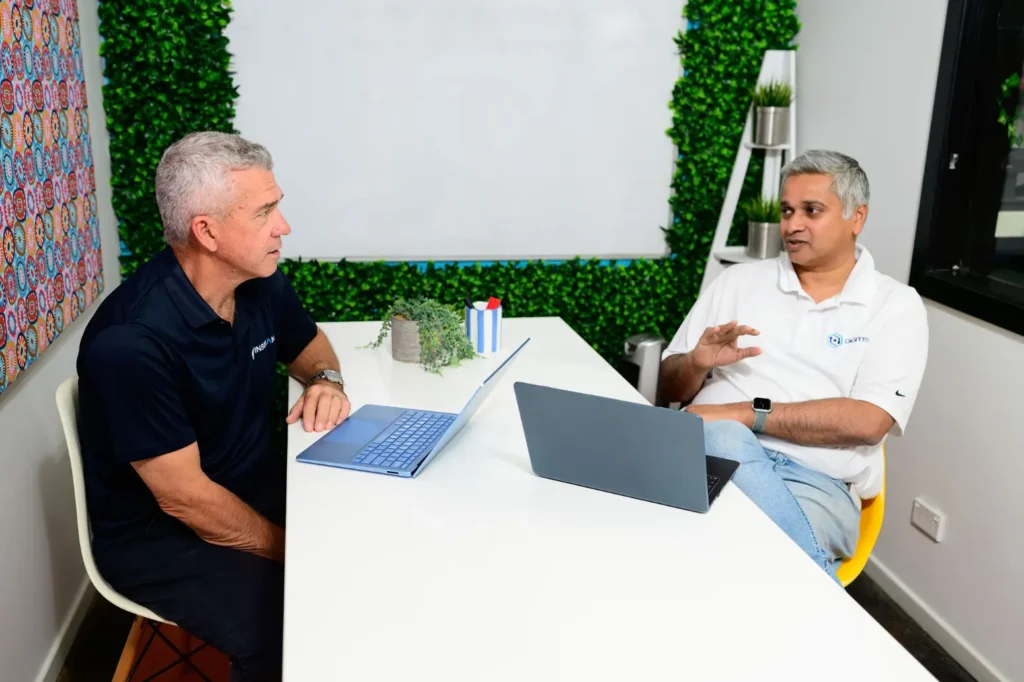 Jim Thomas from Digitek IT listening to a client in a meeting room