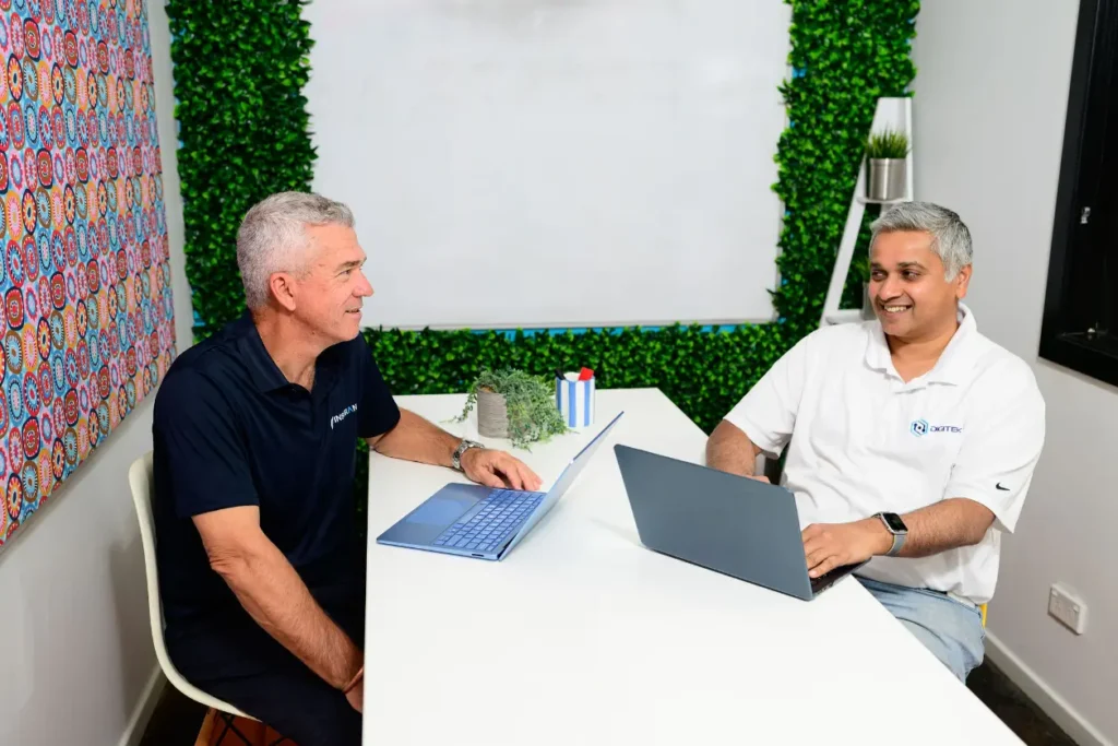 Jim Thomas from Digitek IT meeting with a business owner to review their IT