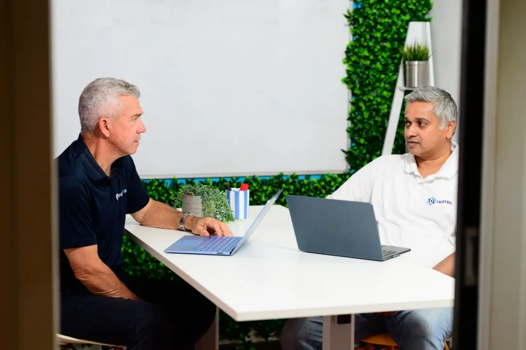 Jim Thomas from Digitek IT explaining an IT plan to a client