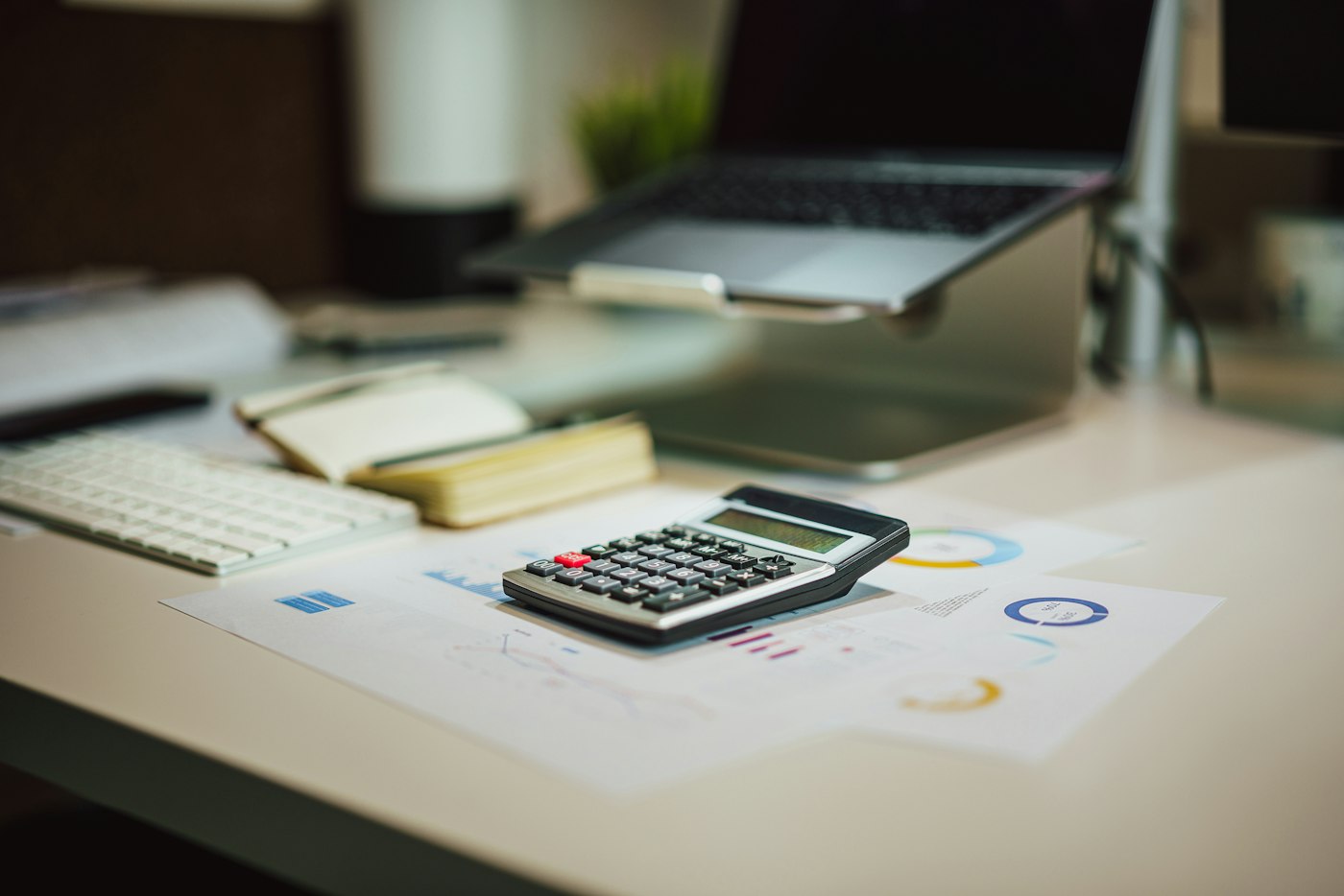 Calculator and paperwork on a bookkeeper's desk